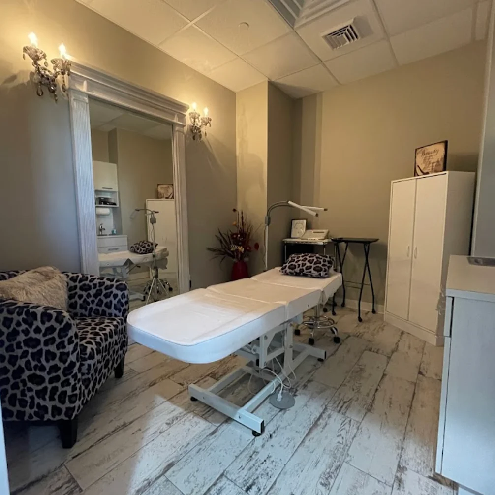 Modern salon interior featuring styling stations, mirrors, chairs, and professional beauty equipment